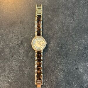 Women’s gold and tortoise watch by Fossil